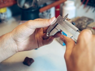 Different goldsmiths tools on the jewelry workplace. Jeweler at work in jewelry.